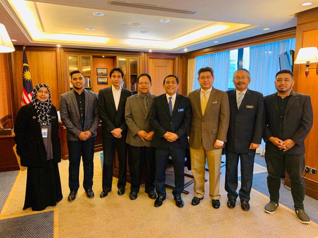 AGA Group leadership with partners at an official ceremony